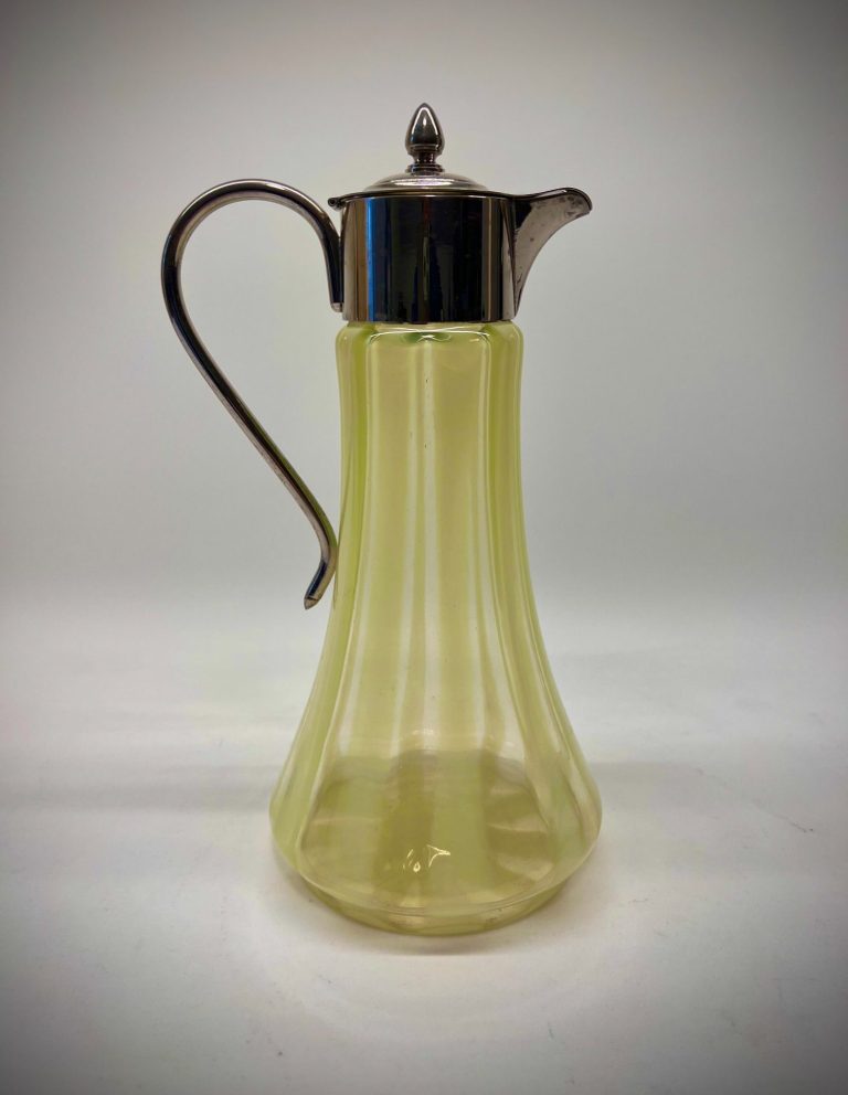 Art Nouveau Uranium Glass Jug – English Vaseline Glass, ca. 1900 English Art Nouveau uranium glass jug with silver-plated lid and handle, fluted striped Vaseline glass body, ca. 1900.