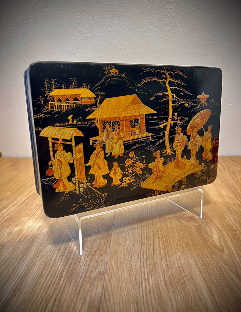 Antique Lacquered Papier-Mâché Box – Gilded Asian Scene Antique lacquered papier-mâché box with gilded Asian domestic scene featuring pavilions, figures, and a bridge; black lacquered interior and