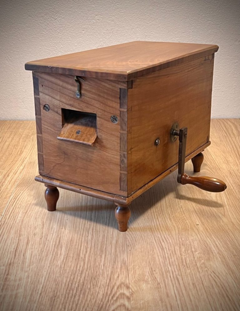 Biedermeier Mystery Box – Crank and Cutter Mechanism, 19th Century Biedermeier-era wooden box with hand crank, spiked roller, and internal cutter mechanism, dovetail joints and turned legs, function unknown