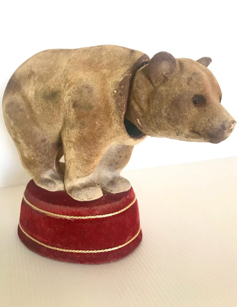 Vintage Nodding Bear – Flocked Toy on Velvet Pedestal Vintage flocked bear novelty figure with nodding head, mounted on red velvet pedestal with gold trim, early to mid-20th century